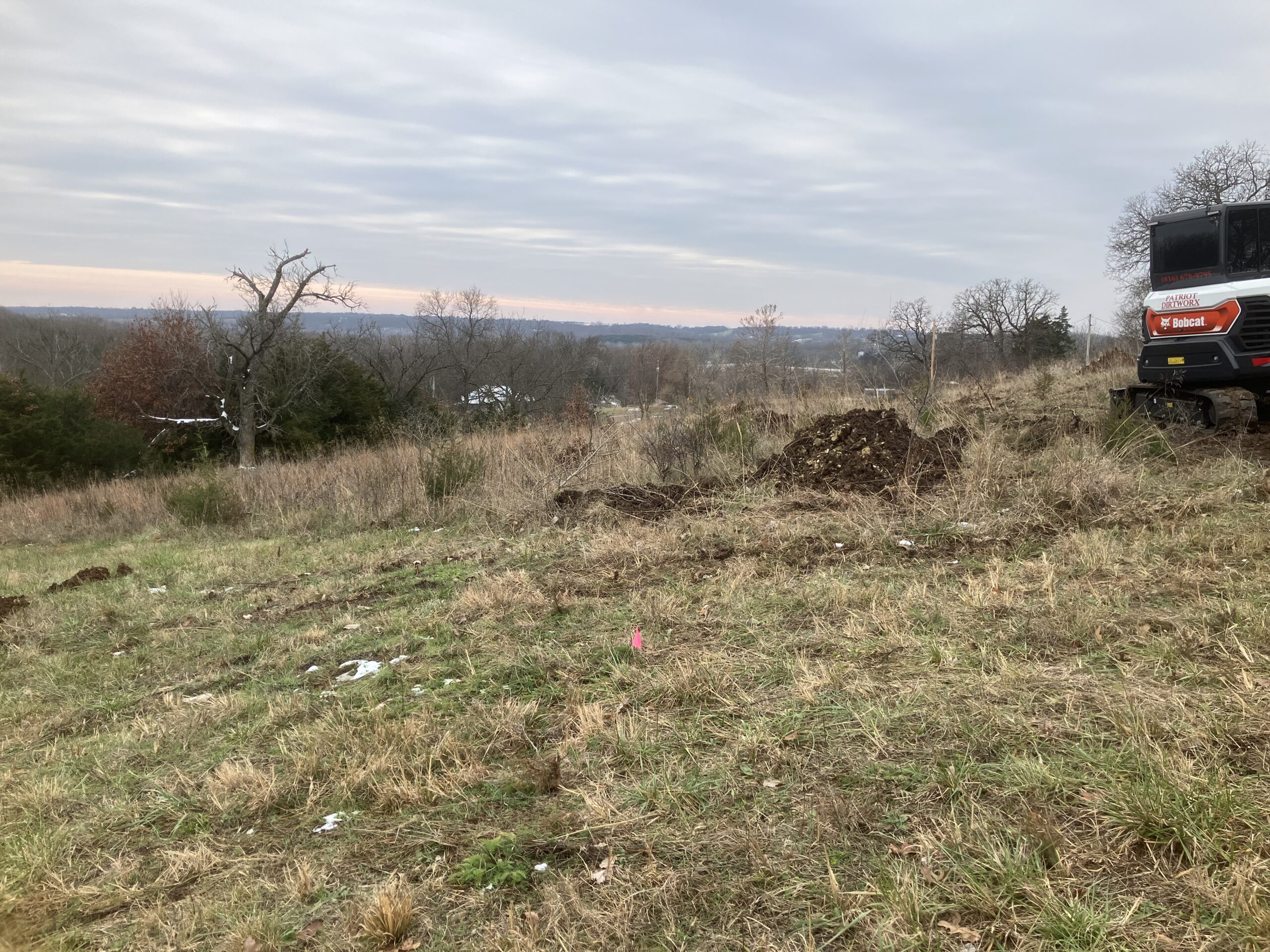Digging test holes for soil survey
